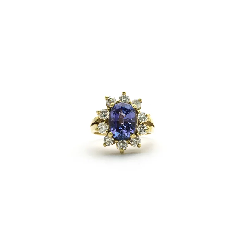 Gorgeous Gemstone Rings For Bold Fashion-Oval Tanzanite Diamond Sunburst Halo Ring (18K)